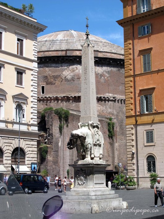 Bernini's elefantino in Piazza Minerva. Behind the obelisk, you can see the domed roof of the Pantheon.